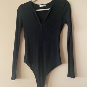 Black long sleeve body suit with shoulders cut out. Size small. Bundle to save $